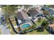 Aerial view of backyard featuring a screened pool and fenced yard at 489 Bohannon Blvd, Orlando, FL 32824