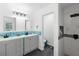 This modern bathroom boasts a walk-in shower, a double vanity and plenty of room for storage and preparation at 489 Bohannon Blvd, Orlando, FL 32824