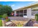 A covered patio includes outdoor seating, view of yard, and access to enclosed patio at 5049 Harbour Dr # 1, Oxford, FL 34484