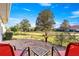 Spacious backyard featuring a patio with outdoor seating, green lawn, and mature trees at 5049 Harbour Dr # 1, Oxford, FL 34484