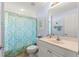 Bright bathroom with a shower, sink, modern fixtures, and decor at 5049 Harbour Dr # 1, Oxford, FL 34484