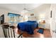 Inviting bedroom featuring wood floors, ceiling fan, and a serene color palette at 5049 Harbour Dr # 1, Oxford, FL 34484