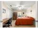 Bedroom featuring a ceiling fan, desk and closet at 5049 Harbour Dr # 1, Oxford, FL 34484