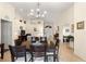 Open-concept dining room showcasing a chandelier and seamless flow to the living spaces with neutral decor at 5049 Harbour Dr # 1, Oxford, FL 34484