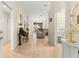 Home foyer featuring tile floors, with views of the dining room, living room, and laundry room at 5049 Harbour Dr # 1, Oxford, FL 34484