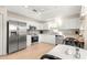 Clean kitchen features white cabinetry and stainless steel appliances at 5049 Harbour Dr # 1, Oxford, FL 34484