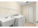 Laundry room with washer, dryer, and utility sink at 5049 Harbour Dr # 1, Oxford, FL 34484