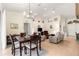 Open concept living room and dining area with tile floors, a ceiling fan, and neutral colors at 5049 Harbour Dr # 1, Oxford, FL 34484