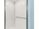 Bright shower stall featuring white subway tile and shelving at 5049 Harbour Dr # 1, Oxford, FL 34484