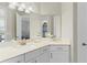 Bright bathroom featuring a modern vanity with white cabinets and countertop and an integrated sink at 5413 Sandy Hill Ln, Lady Lake, FL 32159