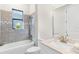 Bathroom featuring vanity, quartz countertop and tiled shower at 5413 Sandy Hill Ln, Lady Lake, FL 32159