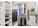 Organized closet featuring hanging clothes, shelves, drawers, and accessories for efficient wardrobe storage and accessibility at 5413 Sandy Hill Ln, Lady Lake, FL 32159