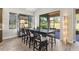 Dining room with tile flooring, and a large window for natural light, perfect for modern living and entertaining guests at 5413 Sandy Hill Ln, Lady Lake, FL 32159