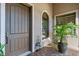 Inviting front entrance featuring a large front door, lovely window, and nice decor at 5413 Sandy Hill Ln, Lady Lake, FL 32159