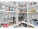 Well-organized walk-in pantry with white shelving, perfect for storing all your kitchen essentials at 5413 Sandy Hill Ln, Lady Lake, FL 32159