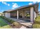 An outdoor patio with nice pavers and an enclosed lanai provide ample outdoor living space at 5413 Sandy Hill Ln, Lady Lake, FL 32159