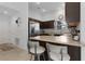 Well-lit kitchen featuring stainless steel appliances, breakfast bar and ample counter space at 5597 Gracie Ln, The Villages, FL 32163