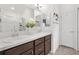 Bathroom featuring double sink vanity, modern fixtures, and a separate shower for convenience at 6051 Chase Ct, The Villages, FL 32163