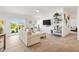 Comfortable living room with lots of sunlight coming in from the sliding glass door at 6051 Chase Ct, The Villages, FL 32163