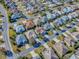 Aerial view shows a neighborhood of single-Gathering homes, each uniquely designed at 610 Mallory Hill Dr, The Villages, FL 32162