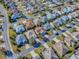 Aerial view shows a neighborhood of single-Gathering homes, each uniquely designed at 610 Mallory Hill Dr, The Villages, FL 32162