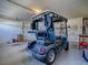 View of the golf cart in the garage with ample storage and parking space at 610 Mallory Hill Dr, The Villages, FL 32162