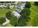 The aerial view highlights the property's location near walking paths and mature landscaping at 6250 Sailboat Ave, Tavares, FL 32778