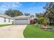 Charming two-story home with well-manicured lawn and two car garage at 6250 Sailboat Ave, Tavares, FL 32778