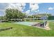 Community shuffleboard courts provide a fun recreational space, surrounded by well-maintained green lawns at 6250 Sailboat Ave, Tavares, FL 32778