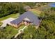 Aerial view of a single Gathering home showing the manicured yard and mature trees at 631 Old Mount Dora Rd, Eustis, FL 32726