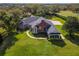 Aerial view of a large estate showing the manicured lawns, mature trees and surrounding landscape at 631 Old Mount Dora Rd, Eustis, FL 32726