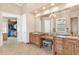 Bright bathroom with dual sinks, a vanity, and a large mirror at 631 Old Mount Dora Rd, Eustis, FL 32726