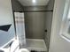 A bright bathroom features an updated shower with modern fixtures at 654 Nw 9Th Ave, Webster, FL 33597