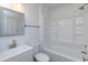 Bright bathroom features a modern vanity, toilet, shower and tub combination and stylish fixtures at 654 Nw 9Th Ave, Webster, FL 33597