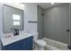 Bathroom with modern vanity and tiled walk-in shower at 654 Nw 9Th Ave, Webster, FL 33597
