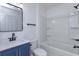 Bathroom with modern vanity and fixtures, with updated tub and shower at 654 Nw 9Th Ave, Webster, FL 33597