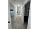 Bright hallway connecting the main living areas of the house at 654 Nw 9Th Ave, Webster, FL 33597