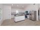 Modern eat-in kitchen with stainless steel appliances and kitchen island at 654 Nw 9Th Ave, Webster, FL 33597