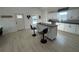 Contemporary kitchen features a central island with bar seating and modern appliances at 654 Nw 9Th Ave, Webster, FL 33597