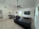 Bright living room with modern decor, vaulted ceilings, and a cozy seating area at 654 Nw 9Th Ave, Webster, FL 33597