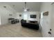 Open-concept living room with vaulted ceilings, stylish furniture, and natural light at 654 Nw 9Th Ave, Webster, FL 33597