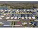 Aerial view of the residential area with a view of the trees, showing the location of the home at 6576 Merrill Ln, The Villages, FL 34762