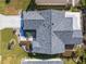 Aerial view of home with a new roof, landscaping, backyard patio and long driveway at 8373 Se 177Th Bartram Loop, The Villages, FL 32162