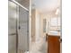 This primary bathroom features a large shower, vanity, mirror, and tile flooring at 8373 Se 177Th Bartram Loop, The Villages, FL 32162