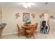 This dining room features a ceiling fan, a round table, and seating for four at 8373 Se 177Th Bartram Loop, The Villages, FL 32162