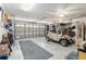 Spacious garage with golf cart, storage and finished epoxy floors at 8373 Se 177Th Bartram Loop, The Villages, FL 32162