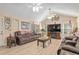 Inviting living room with cozy seating, a fireplace, and lots of windows at 8373 Se 177Th Bartram Loop, The Villages, FL 32162