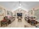 Spacious living room featuring comfortable seating and a vaulted ceiling at 8373 Se 177Th Bartram Loop, The Villages, FL 32162