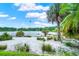 Picturesque backyard featuring a scenic lake view and lush greenery at 840 2Nd St, Clermont, FL 34711