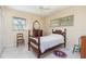 Cozy bedroom features natural light from two windows, and classic furnishings at 840 2Nd St, Clermont, FL 34711